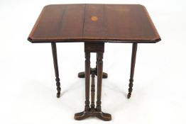 An Edwardian mahogany and satinwood cross banded Sutherland table,
