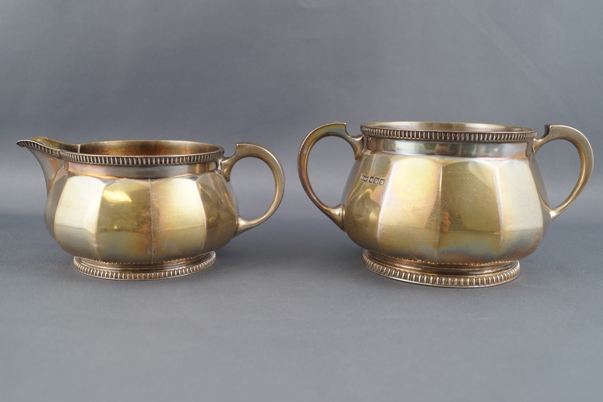 A silver three piece tea service of rounded panelled form, - Image 2 of 2