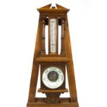 A Victorian oak cased barometer and thermometer,