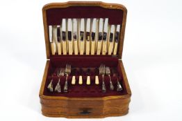 An oak canteen of silver plated cutlery by Flexfit