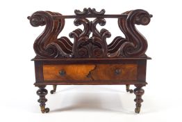 A Regency rosewood music canterbury, three divisions separated by carved scroll upstands,