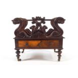 A Regency rosewood music canterbury, three divisions separated by carved scroll upstands,