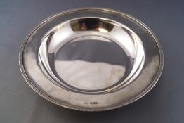 A plain round form silver Armada dish style bowl with applied and decorated rim, Sheffield 1935,