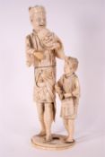 A late 19th century Japanese ivory sectional figure of two figures