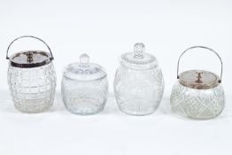 Four clear cut-glass biscuit barrels, two with plated collars and covers,
