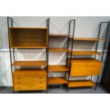 A Ladderax modular wall unit comprising four supporting black metal uprights (201cm high),