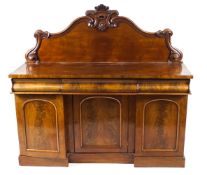 A Victorian mahogany sideboard with raised back above three mould drawers and three panelled doors