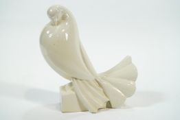 Jacques Adnet, Pigeon Tete Penchee, a 1930's Art Deco pottery stylised pigeon, glazed in cream,