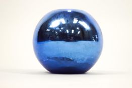 A metallic blue glass ball vase,