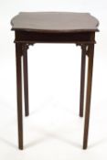A mahogany occasional table with shaped square top on square legs with pierced fret work brackets,