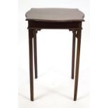 A mahogany occasional table with shaped square top on square legs with pierced fret work brackets,