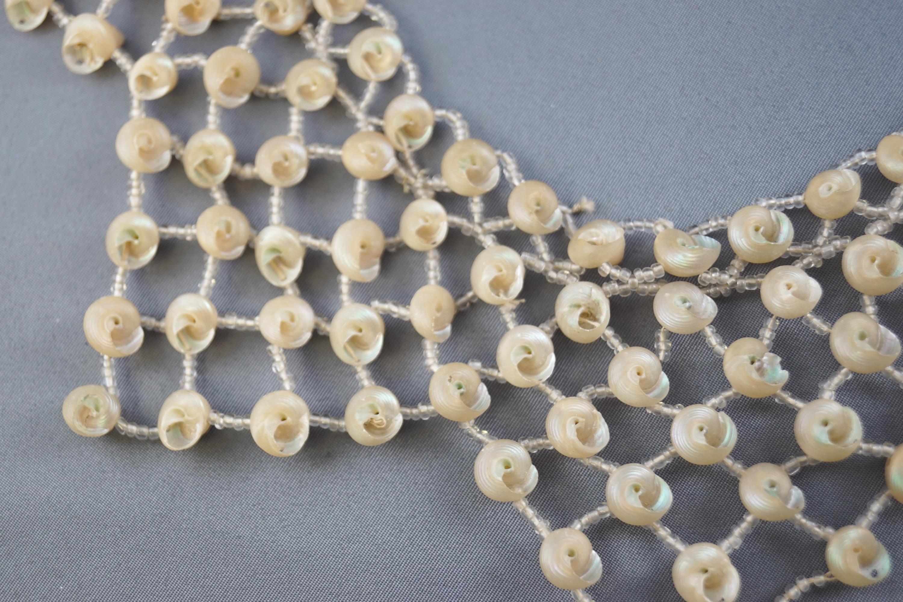 An abstract necklace strung with small shells and inter spaced with colourless seed beads, - Image 2 of 2