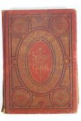 A 19th century red cloth bound black and gilt stamped Scrapbook,