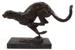 A 20th century bronze of a sprinting cheetah, on a black marble base,