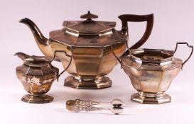 A silver three piece tea service of flared octagonal form,