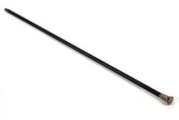 An ebony walking cane with silver top,