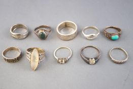 A collection of ten silver dress rings of variable designs. Size range from L to Q.