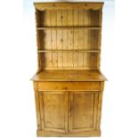 A Victorian pine two shelf dresser, the base with a long drawer over a two door cupboard,