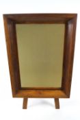 A hardwood framed mirror of rectangular form, with inner slip to the plate in the canted frame,