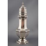 A silver octagonal baluster sugar caster with pierced pull off lid,