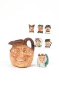 A Royal Doulton John Barleycorn character jug and six Royal Doulton miniature character jugs