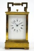A brass cased five glass repeater carriage clock with fixed Roman dial, striking on a gong,