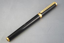 A Mont Blanc fountain pen, of plain cylindrical form, cartridge model with pull off cap,