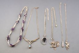 A collection of six silver necklaces of variable designs.