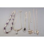 A collection of six silver necklaces of variable designs.