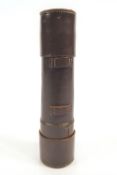 A leather cased brass five pull telescope, with additional sliding visor,