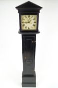 An 18th century ebonised long case clock with later painted dial, height 213cm,