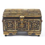 A Middle Eastern casket of domed top form inlaid/set with bone and brass ribbing and wire,