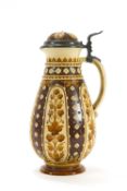 A 19th century Metlach jug with pewter mounted hinged cover, impressed factory marks, numbered 1815,