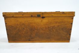 A pine trunk of tapered rectangular form, the top plank made over a dovetail joined panel base,