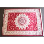 A red ground Keshan carpet,