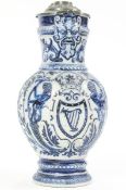 A Westerwald style jug with grey and blue relief decoration, including a male mask at the lip,