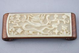 A carved jade and wood brush stand of rectangular form,