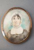 An early 19th century portrait miniature of a lady, watercolour on ivory within gilt metal locket,