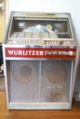 A Wurlitzer 'Hi Fi Stereo' Juke box in a chrome and glass finish,