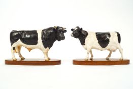 A Beswick figure of a friesian cow and bull, Connoisseur models, mounted on wooden bases,