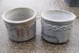 A pair of lead garden planters of cylindrical form,