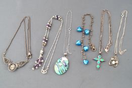 A selection of six silver necklaces of variable designs.