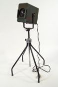 A stage light, with front slot for coloured filters, on an adjustable stand, max height 142cm.