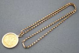 A yellow gold full sovereign dated 1911 in a 9ct gold mount and suspended from a 9ct gold chain.