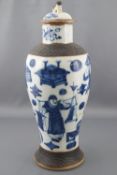 A Chinese porcelain vase and cover of elongated baluster form,