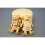 Two 19th century Hertwig bisque teddy bears, painted yellow,