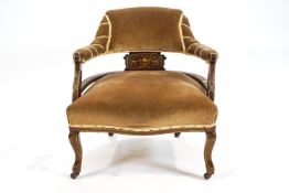 An Edwardian mahogany inlaid nursing chair,