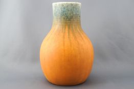 A Ruskin pottery orange and turquoise glazed baluster vase, impressed mark to base,