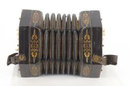 An A C Jeffries Accordion, in original mahogany case with leather strap handle. 22cm.
