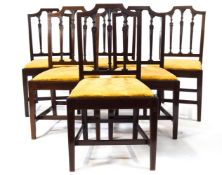 A set of six mahogany satinwood inlaid Hepplewhite style dining chairs with shaped backs over a